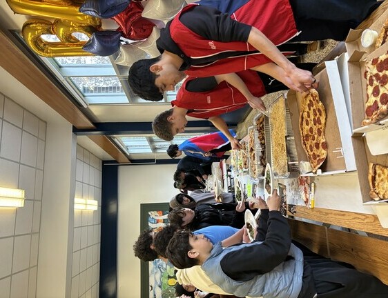 Families gather at the 'Taste of Cultures' Potluck at Brookfield HS.