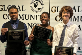 three OCDSB student award recipients holding their award certificates at the Global Community Alliance Gala